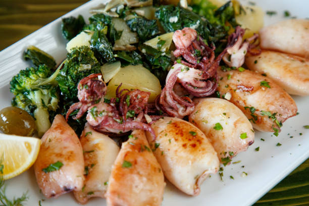 Grilled calamari served with boiled potato, broccoli and chard