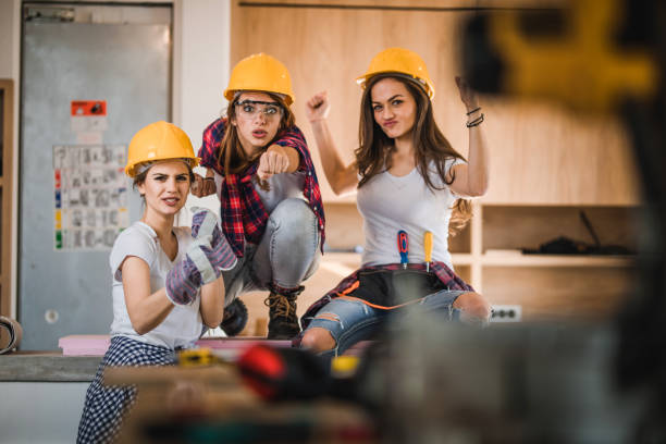 super heroes of apartment renovations! - muscular build bicep women female imagens e fotografias de stock