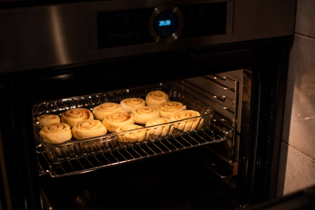istock homemade cinnamon rolls, baking in the owen 1132479894