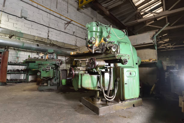 Very old CNC machine for processing metal parts, retro style. at the factory