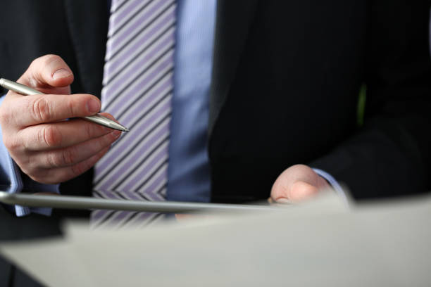 istock Businessmen and woman look and study statistics 1132482680
