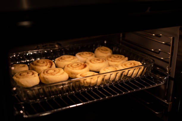 istock homemade cinnamon rolls, baking in the owen 1132484361