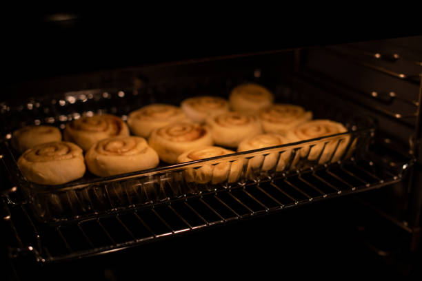 istock homemade cinnamon rolls, baking in the owen 1132485507