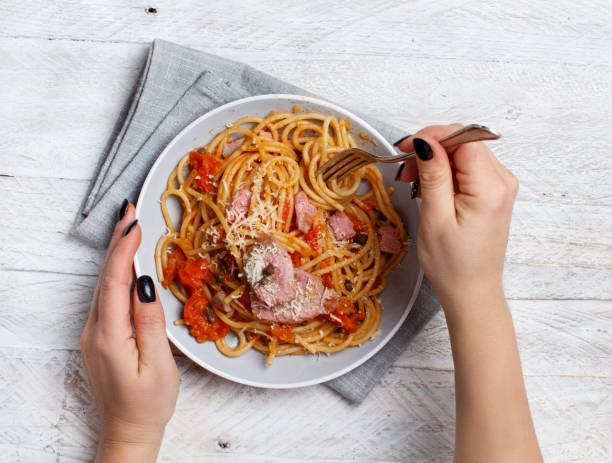 istock Pasta with chunks of fresh tuna, tomato and capers 1132485783