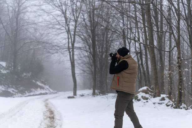 istock Man taking picture on a winter day 1132486413