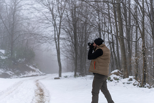 Man taking picture on a winter day
