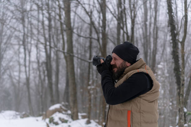 istock Man taking picture on a winter day 1132486512
