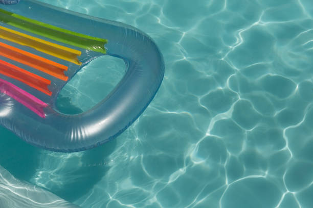 istock Inflatable tube floating in a swimming pool 1132487122