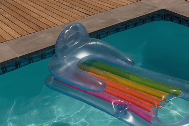 istock Inflatable tube floating in a swimming pool 1132487171