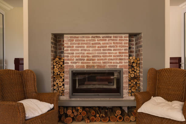 istock Fireplace in living room at home with chairs 1132487389