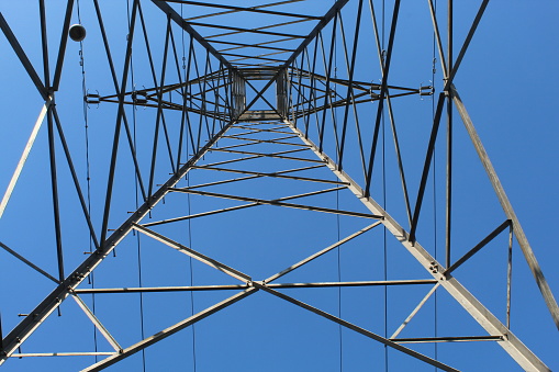 Low Angle View Of Electricity Pylon Against Clear Blue Sky taken in public spaces