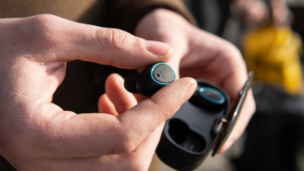 istock wireless headphones close-up. autonomous headphones with charging 1132489165