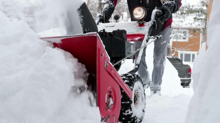 4K Video of a Senior Man Using SnowBlower After a Snowstorm