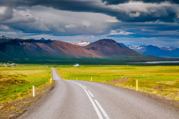 istock Empty road leading along the coast. Typical Icelandic landscape. 1132491165
