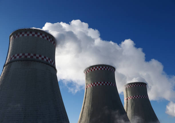 istock White harmful smog in blue sky vaporing from industrial pipes 1132493733