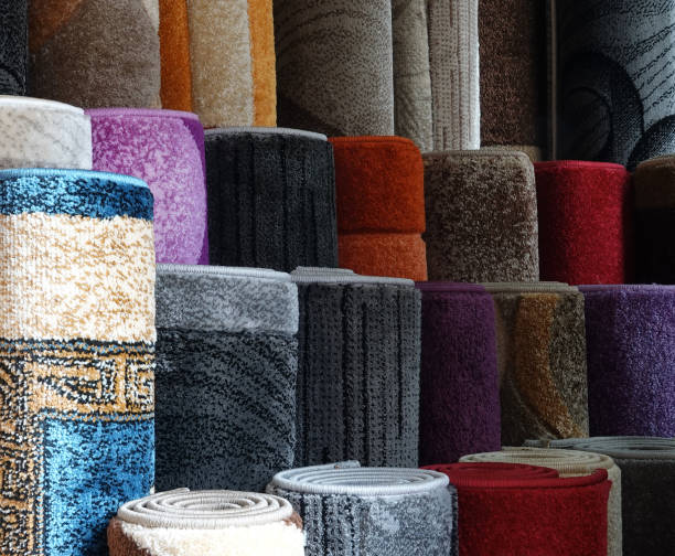 istock Carpets variety selection rolled up rugs shop store lot 1132494634