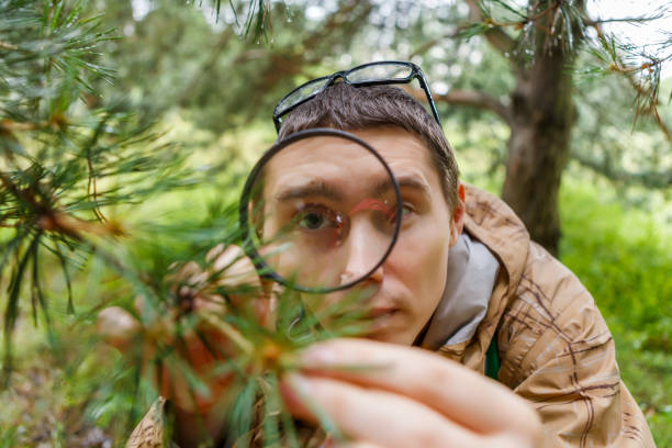 istock Picture of guy with magnifying glass 1132495436