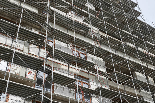 istock new building under construction, scaffolding and concrete 1132495785