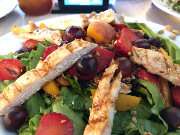 istock salad with fruits and grilled chicken 1132495970