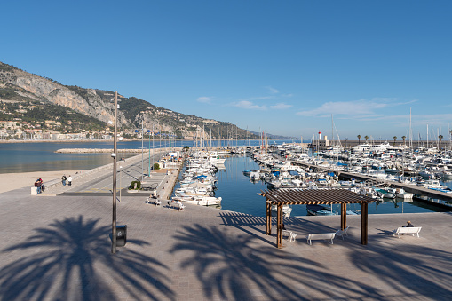 Menton, France - February 25, 2019: Panoramic view of touristic harbour at Menton in French Riviera
