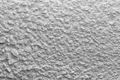 Whitewashed Cement Black And White Whitewashed Concrete Wall Interspersed With Stones ...