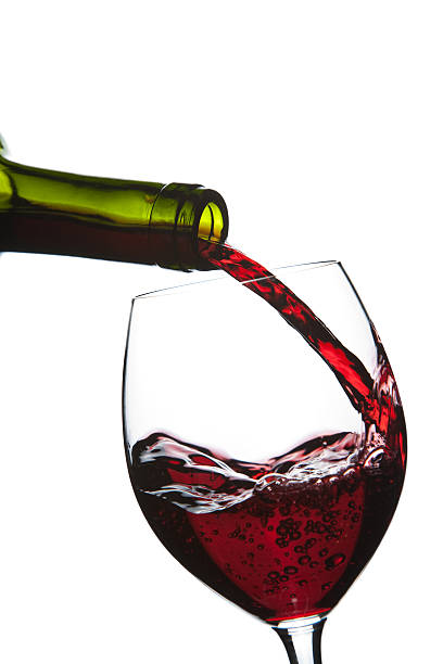 istock red wine pouring into glass isolated 113249952
