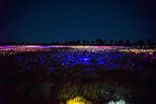 Yulara, Australia - February 17th, 2019: Field of lights in Yulala near Uluru. so many of light of the wild field