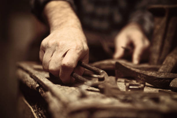 istock Midsection Of Male Shoemaker With Tools In Workshop 1132507181
