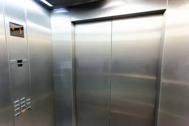 Photo of interior of a modern silvery elevator