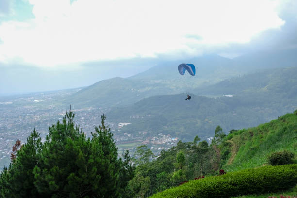istock Sky racing by paragliding in Batu Malang, east java, Indonesia. 1132511697