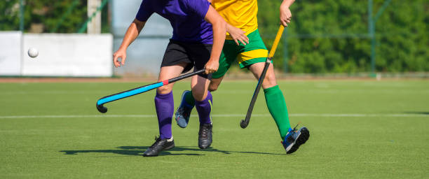 istock Low Section Of Men Playing Hockey On Turf 1132511937