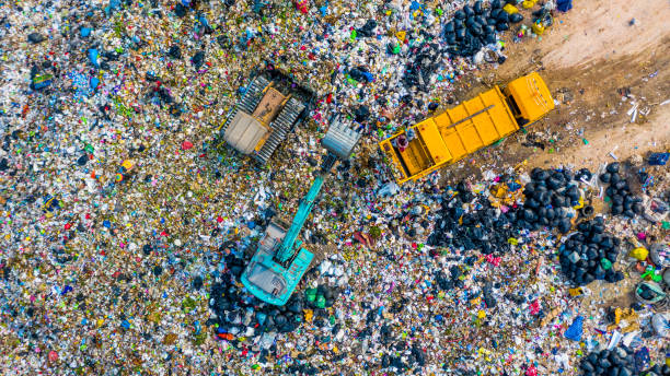 istock Garbage pile  in trash dump or landfill, Aerial view garbage trucks unload garbage to a landfill,  global warming. 1132513027