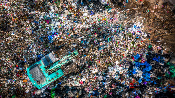 garbage pile  in trash dump or landfill, aerial view garbage trucks unload garbage to a landfill,  global warming. - garbage dump imagens e fotografias de stock