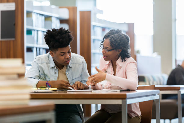 istock Teenage boy receives help from tutor 1132514148