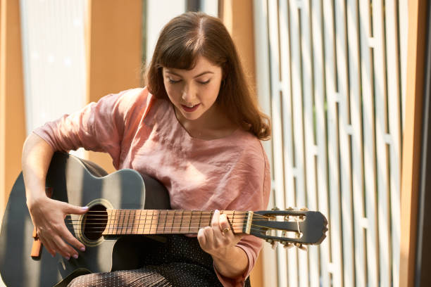 istock Creative woman with guitar 1132514170