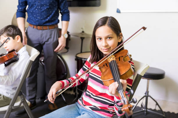 istock Girl Improving Violin Skills In Class 1132515689