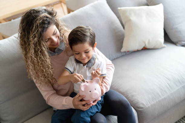 istock Mother and son saving money for the future 1132516126