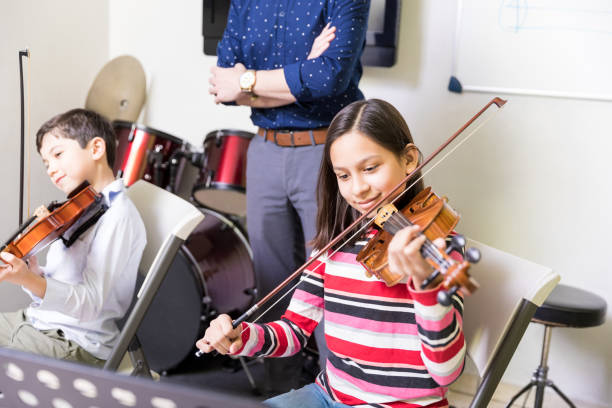 istock Kids Practicing Some New Sound On A Violin 1132516197