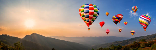 istock Colorful hot air balloon fly over mountain view 4 1132516233