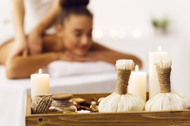 istock Spa composition with herbal bags and candles 1132517759