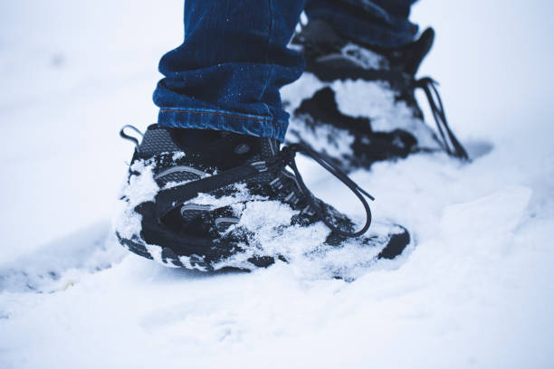 istock walk in the forest with boots at snowy weather 1132517874