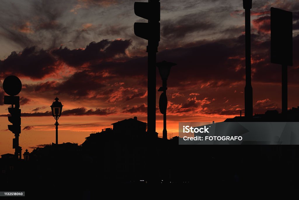 tamonto in the city Florence, Italy - September 20, 2017. Sunset over Florence. Red sky. silhouettes of houses. Art Product Stock Photo