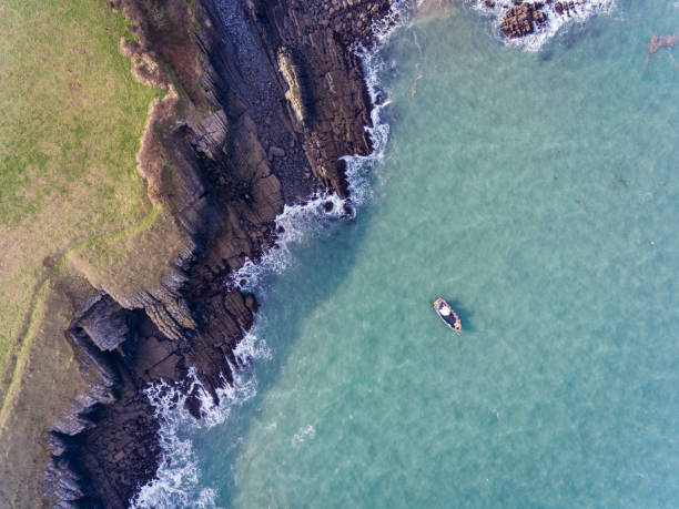 Aerial view of a boat in the Bay at Stackpole Quay