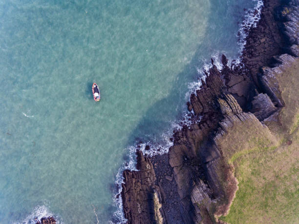 istock Aerial view of a boat in the Bay at Stackpole Quay 1132521178