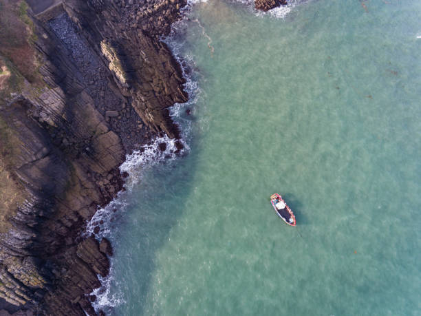 istock Aerial view of a boat in the Bay at Stackpole Quay 1132521503