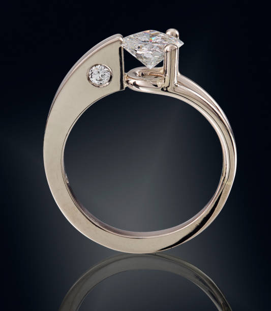 istock Golden ring with gemstone isolated on black background 1132522377