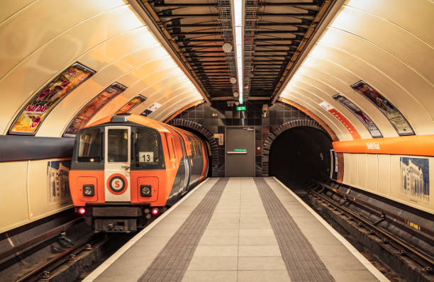 Glasgow, UK - A Subway train in motion as it arrives at Shields Road station.