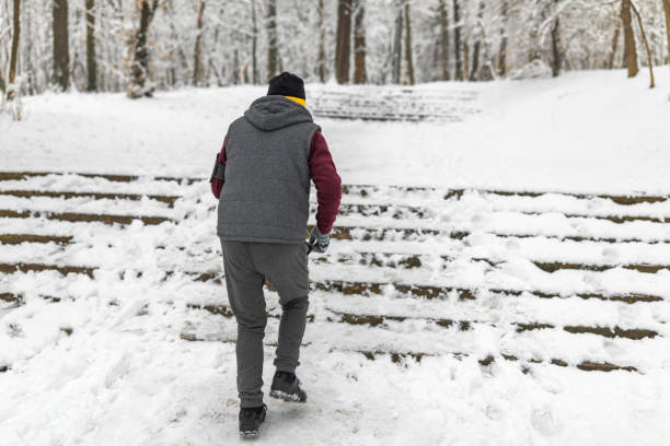 istock Senior man jogging in snow 1132523127