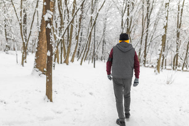 istock Senior man jogging in snow 1132523326