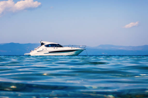 istock Motor boat floating on clear turquoise water 1132526487